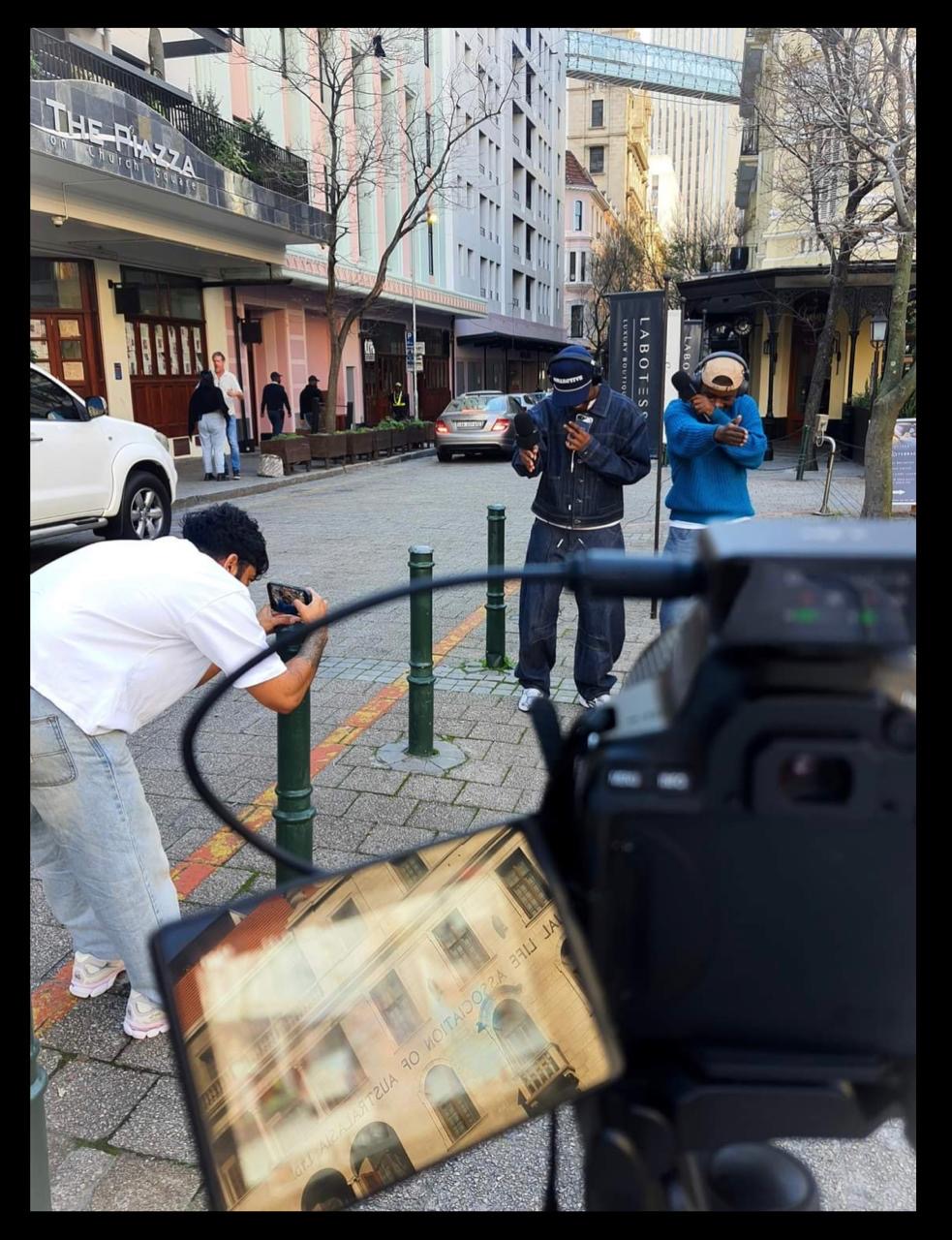 Behind the scenes on Church Square: camera crew filming talent on the street